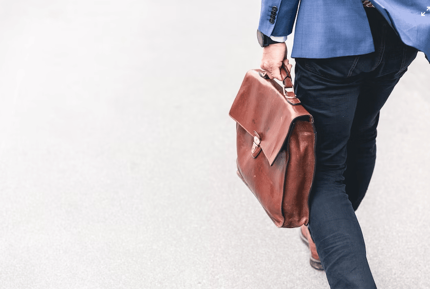 color blind men walking with bags for seek job