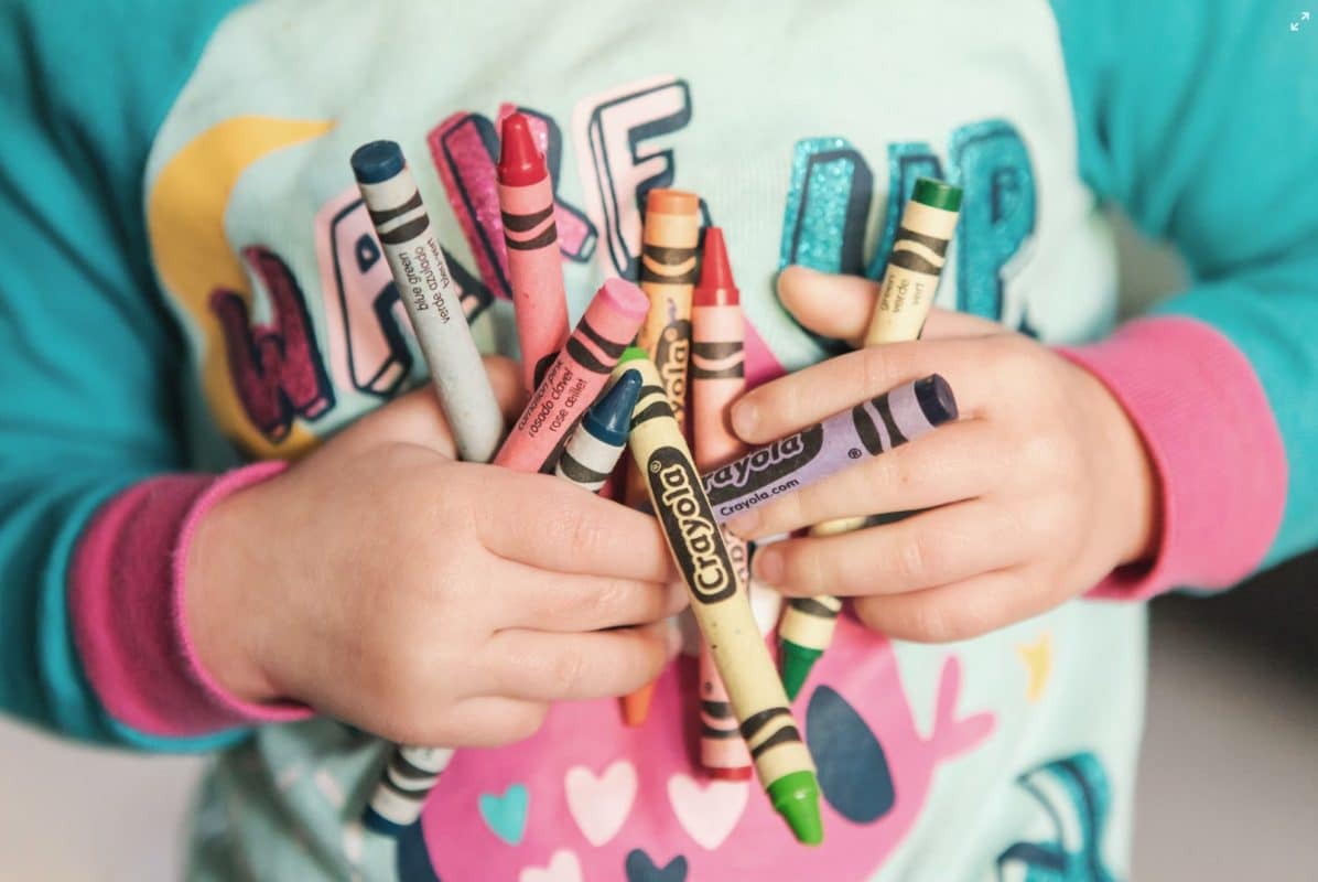 children hold color pen